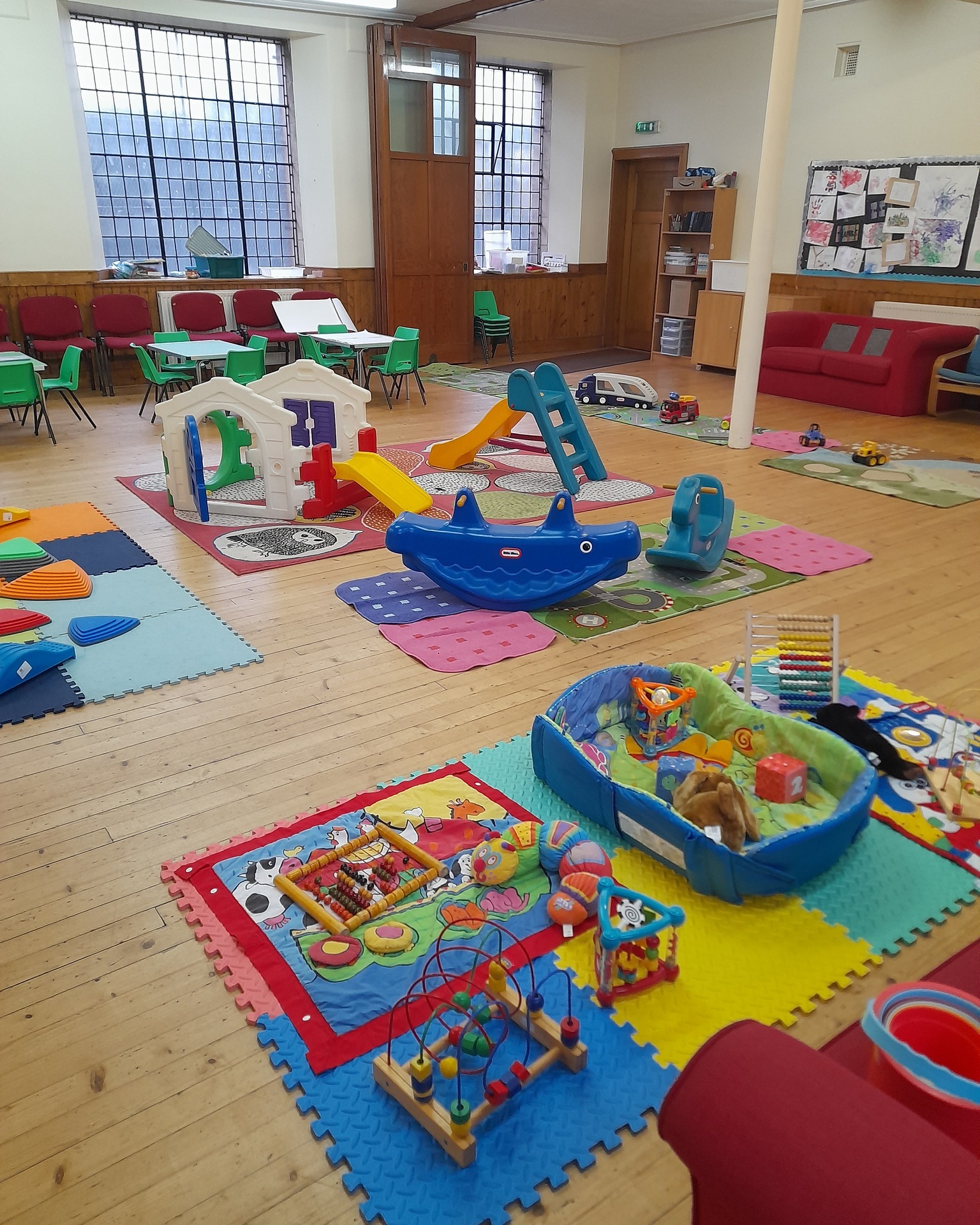 Colourful baby and toddler toys in church hall