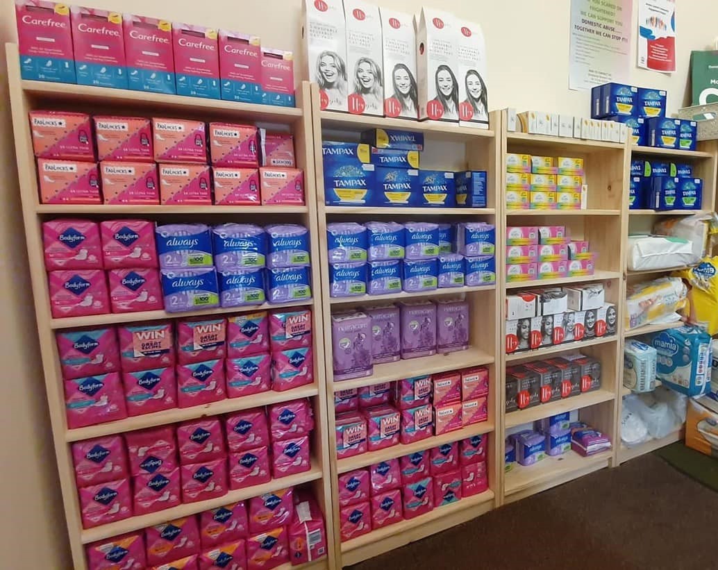 A large shelving display of various period products.