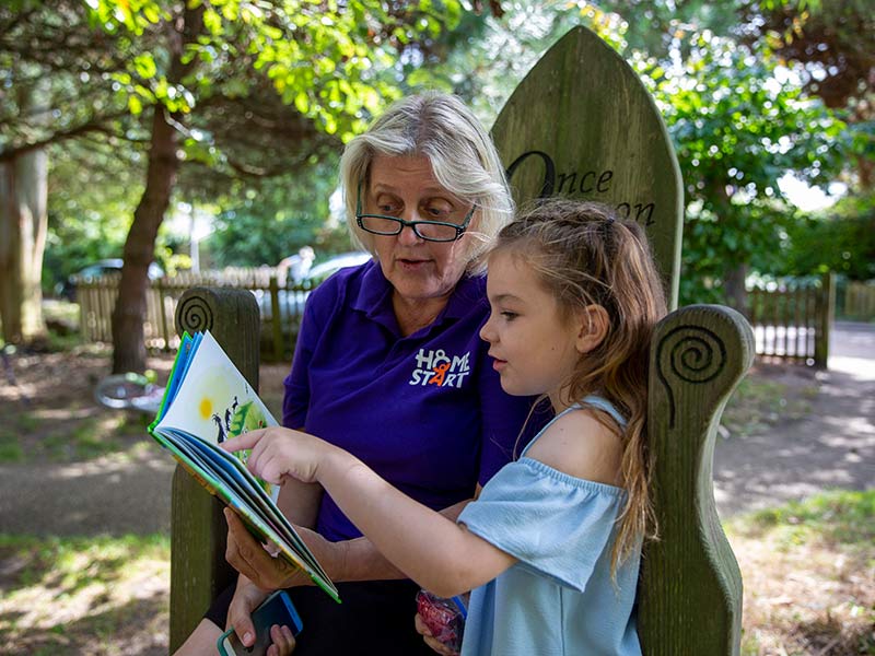 Volunteer reading to a child